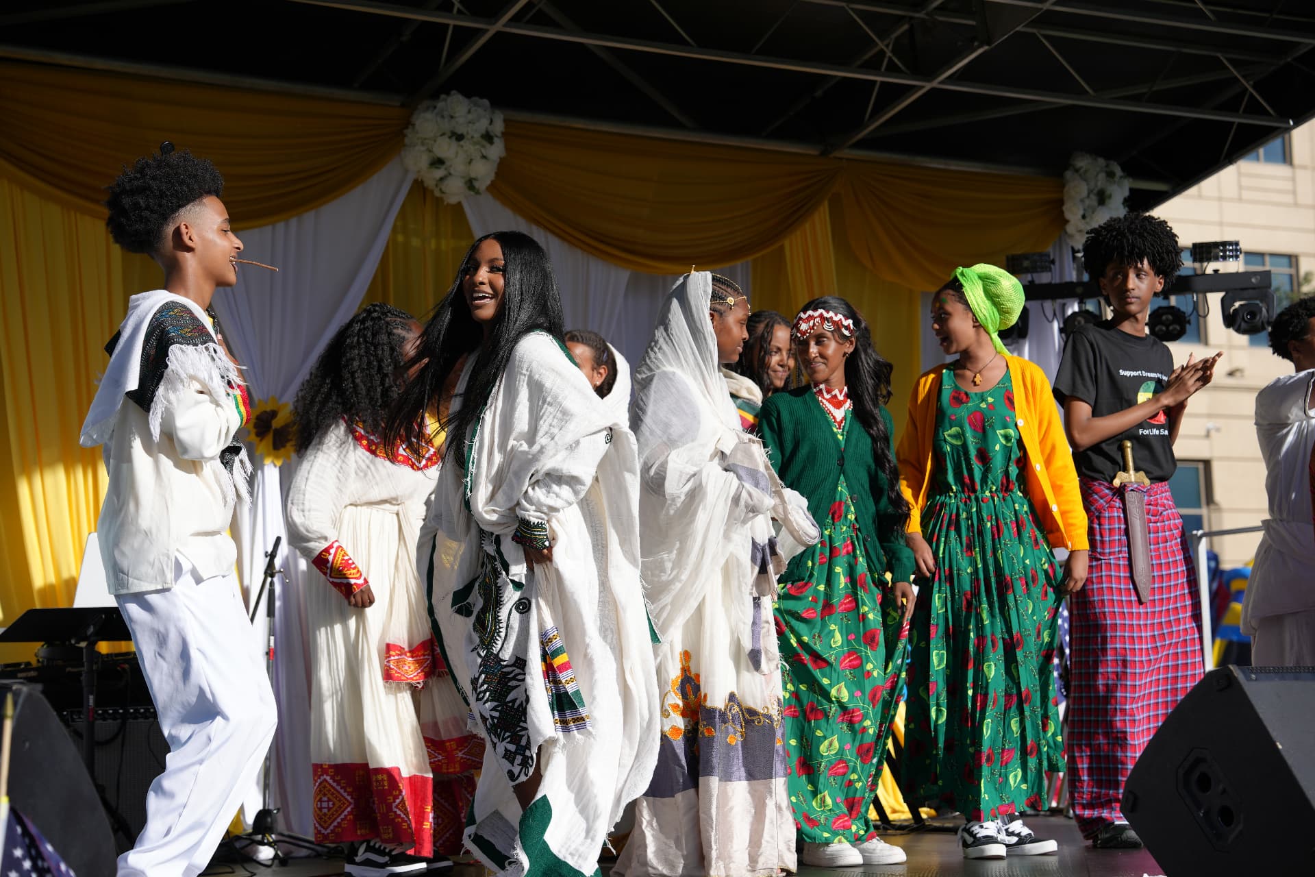 Performers in traditional Ethiopian dress on the Ethiopian Day stage