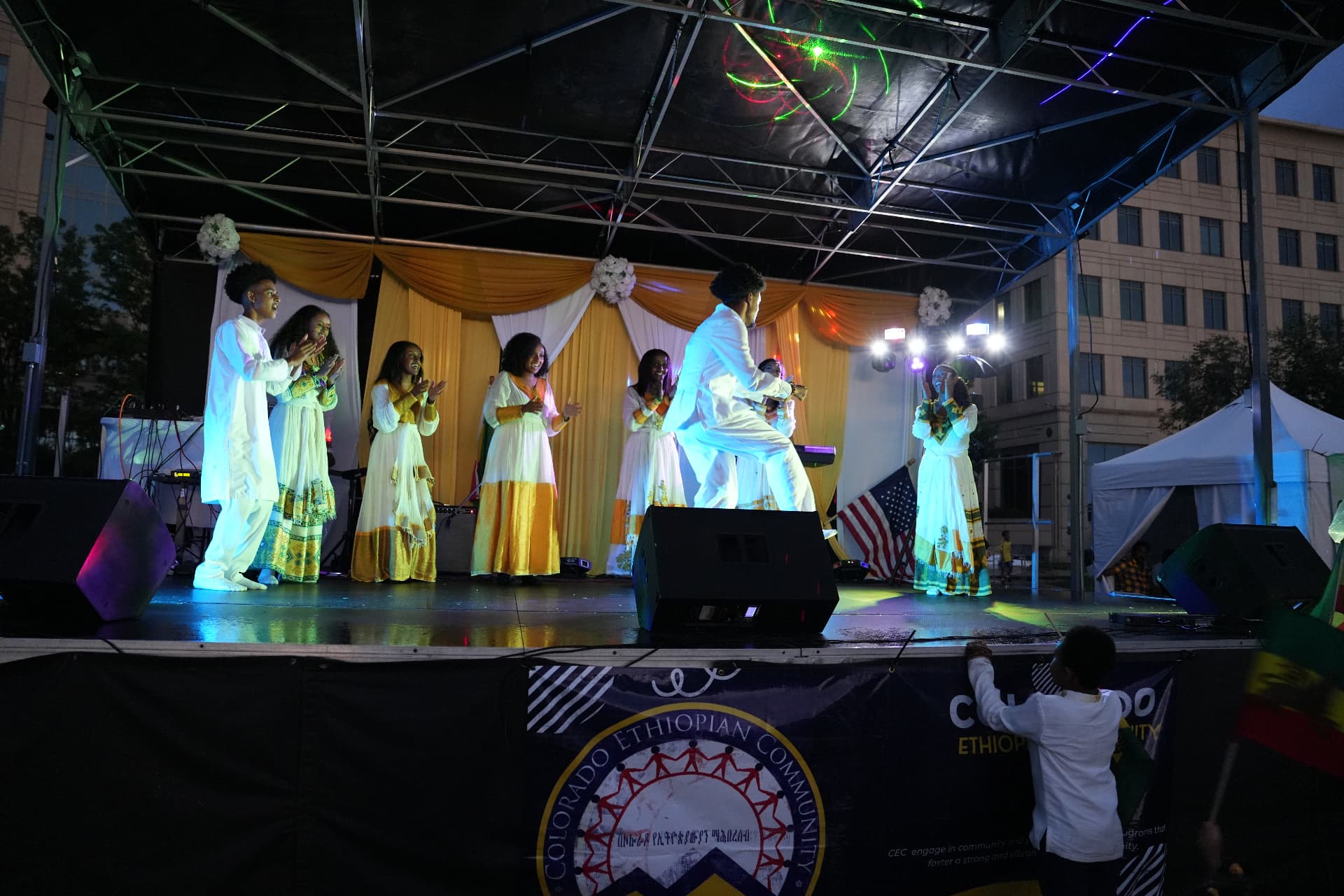 Ethiopian cultural dancers performing on the Ethiopian Day main stage at night