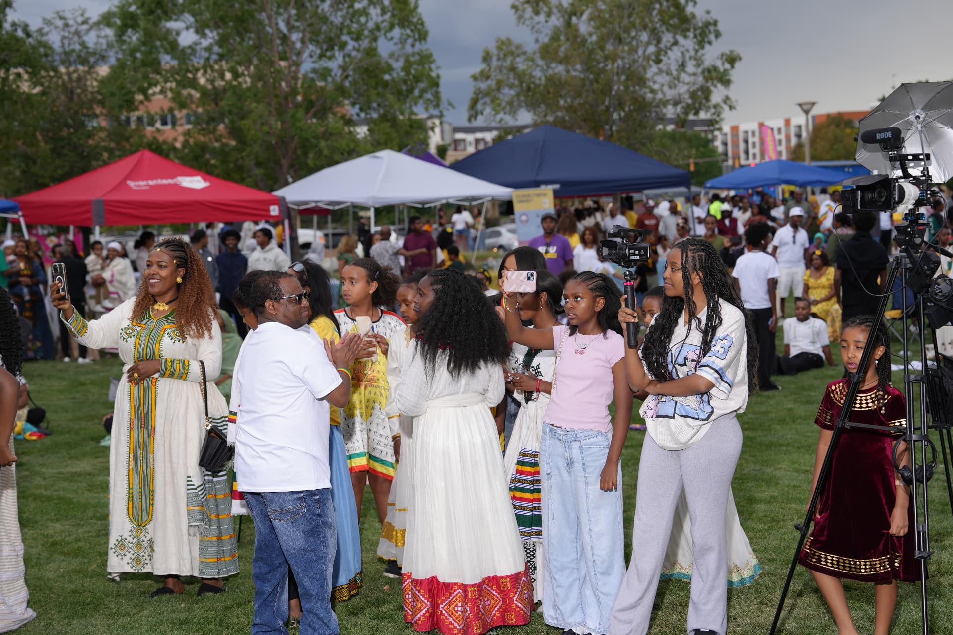 Families in traditional Ethiopian dress gathered at Ethiopian Day in Centennial Center Park